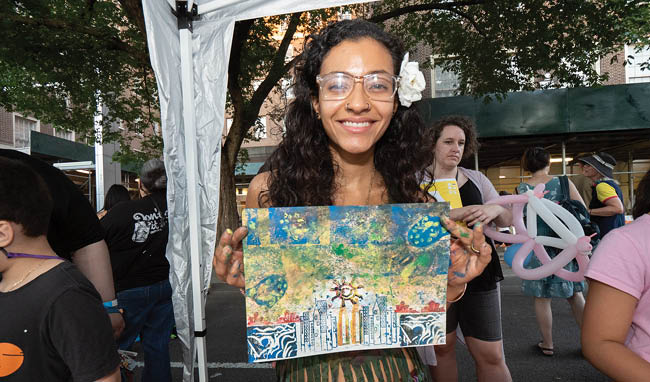 a woman holding a painting